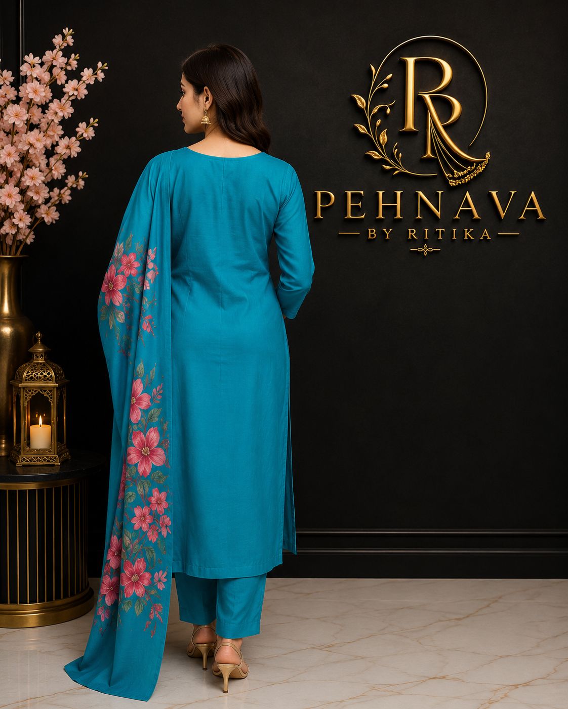 Turquoise Blue Floral Printed Kurta Pant Set with Embroidered Neckline and Matching Dupatta for Women.
